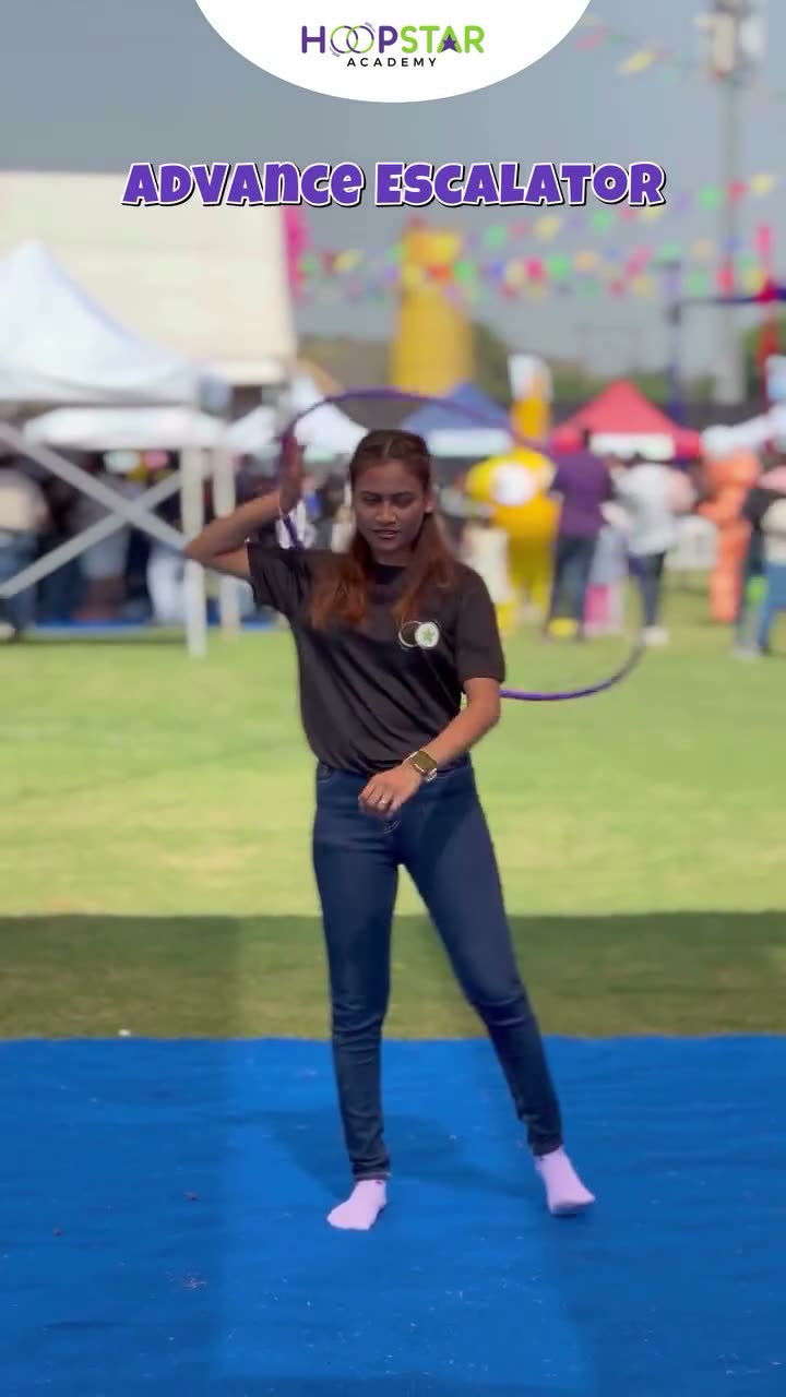 A child demonstrating Advanced Escalator — a Level 2 hula hoop skill