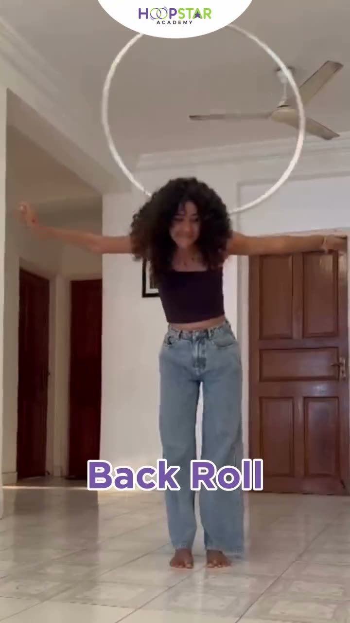 A child demonstrating Back Roll — a Level 4 hula hoop skill