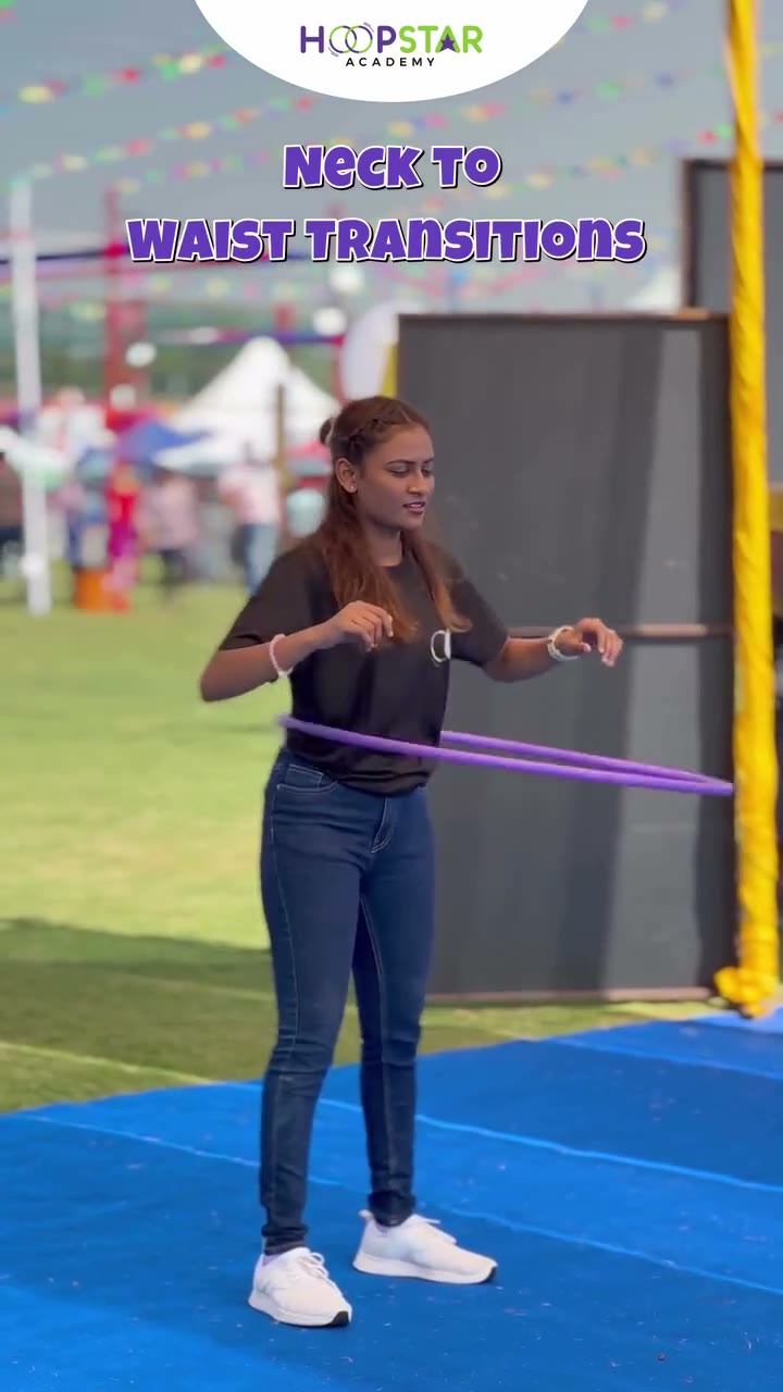 A child demonstrating Belly Breaks — a Level 1 hula hoop skill