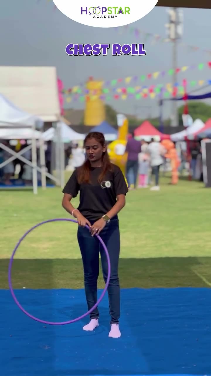 A child demonstrating Chest Roll — a Level 2 hula hoop skill