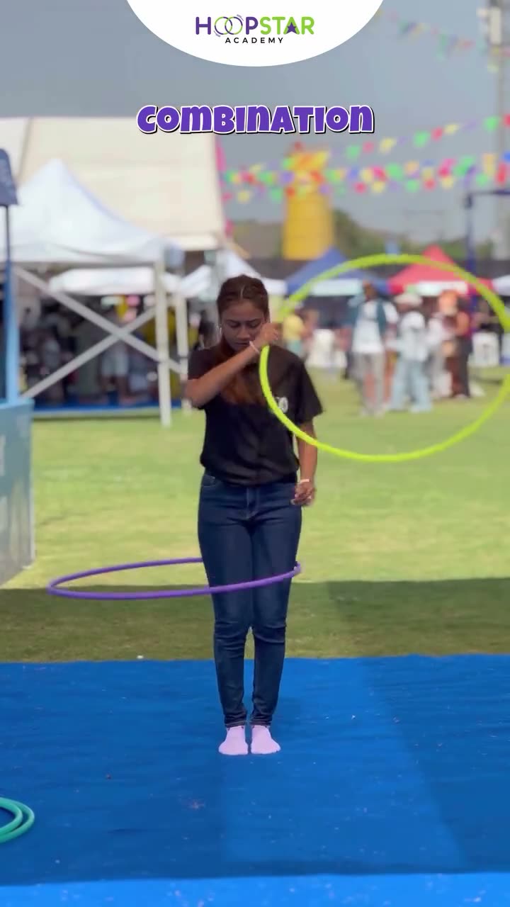 A child demonstrating Combination — a Level 2 hula hoop skill