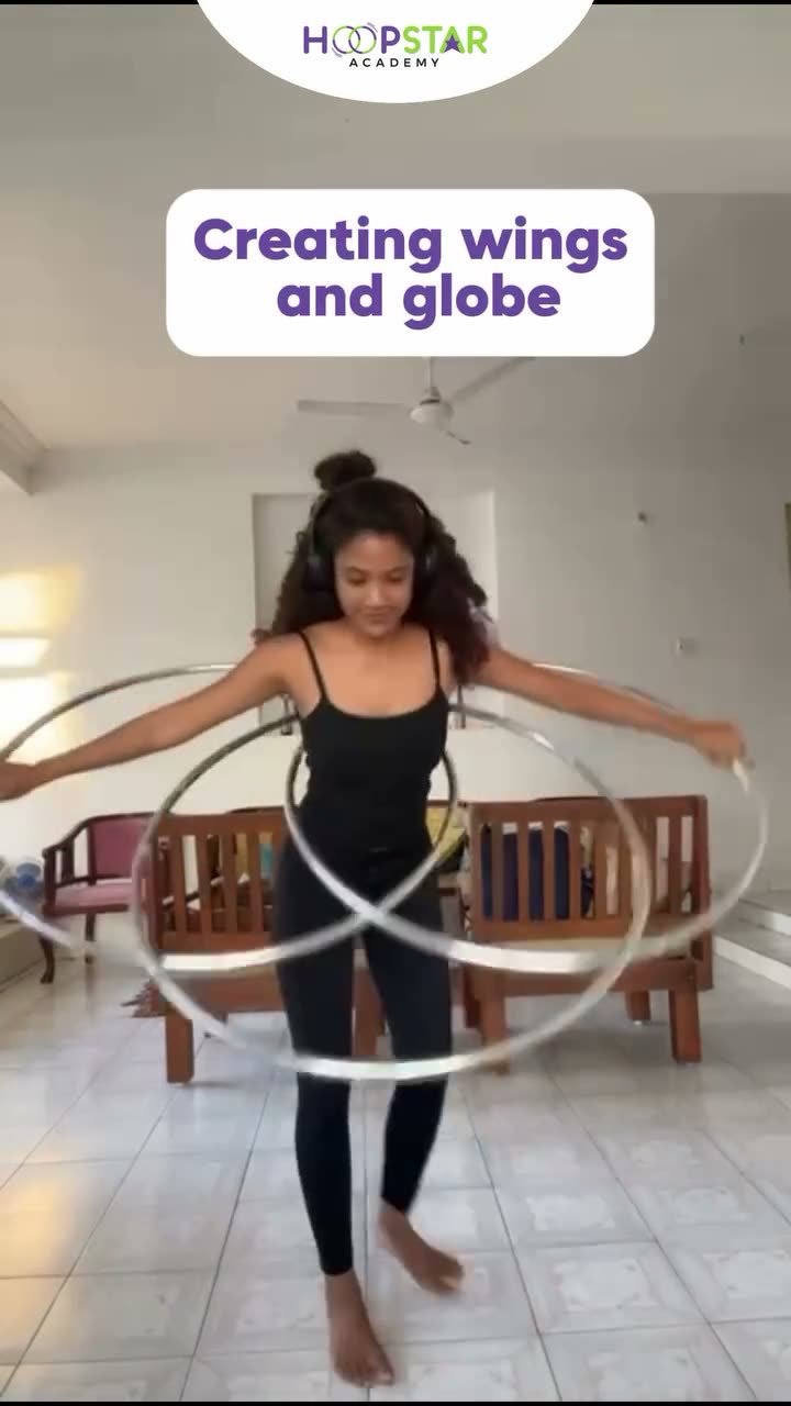 A child demonstrating Creating Wings — a Level 5 hula hoop skill