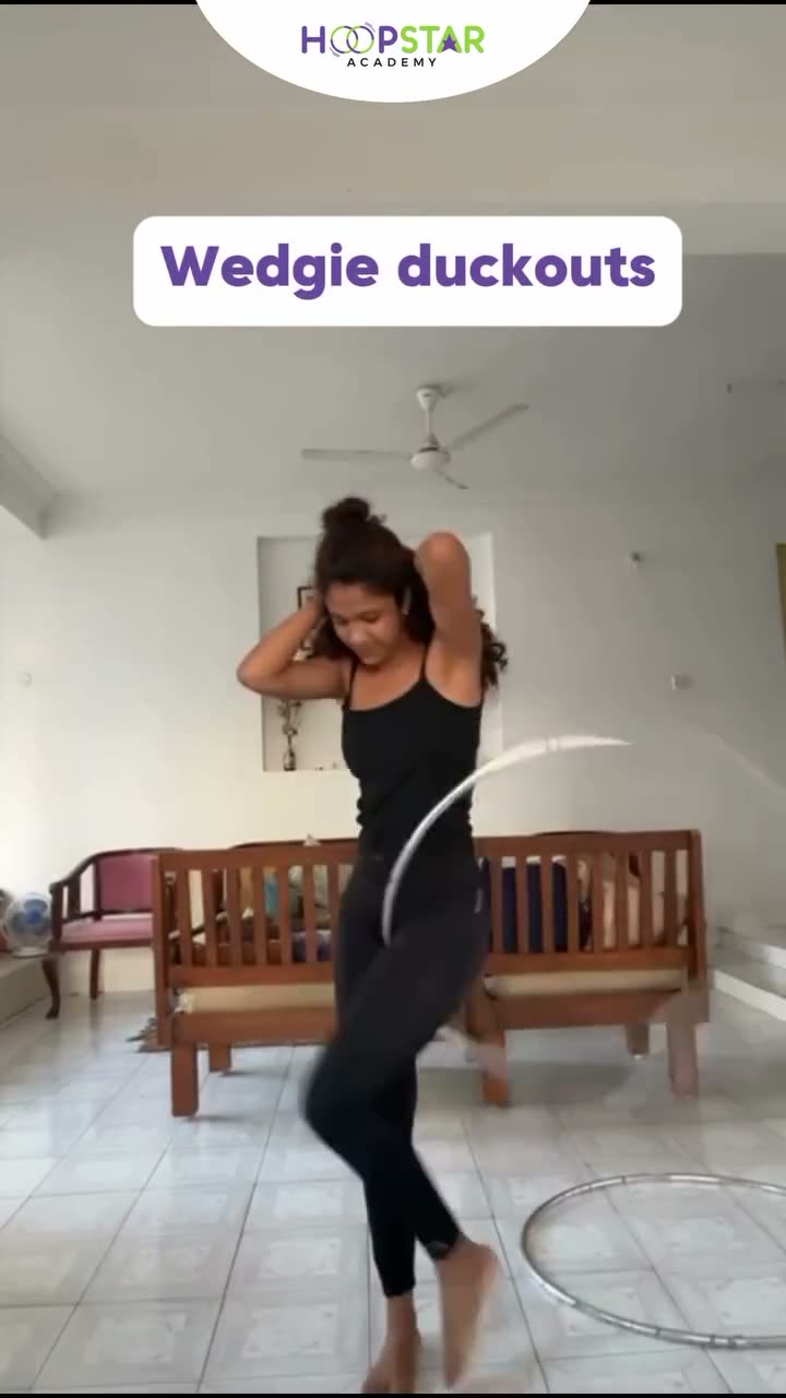A child demonstrating Duck In & Out — a Level 5 hula hoop skill