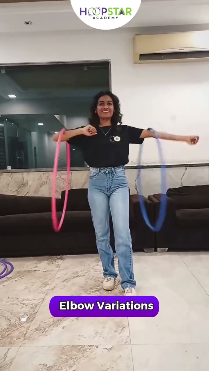 A child demonstrating Elbow Spins & Variations — a Level 3 hula hoop skill