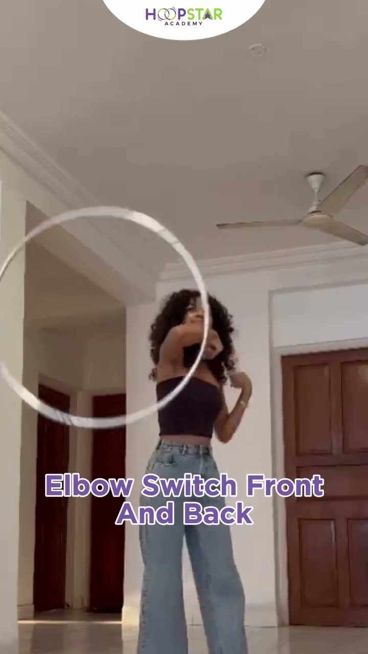 A child demonstrating Elbow Switch (Front & Back) — a Level 4 hula hoop skill