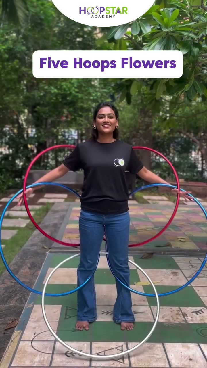 A child demonstrating Five Hoops Flowers — a Level 6 hula hoop skill