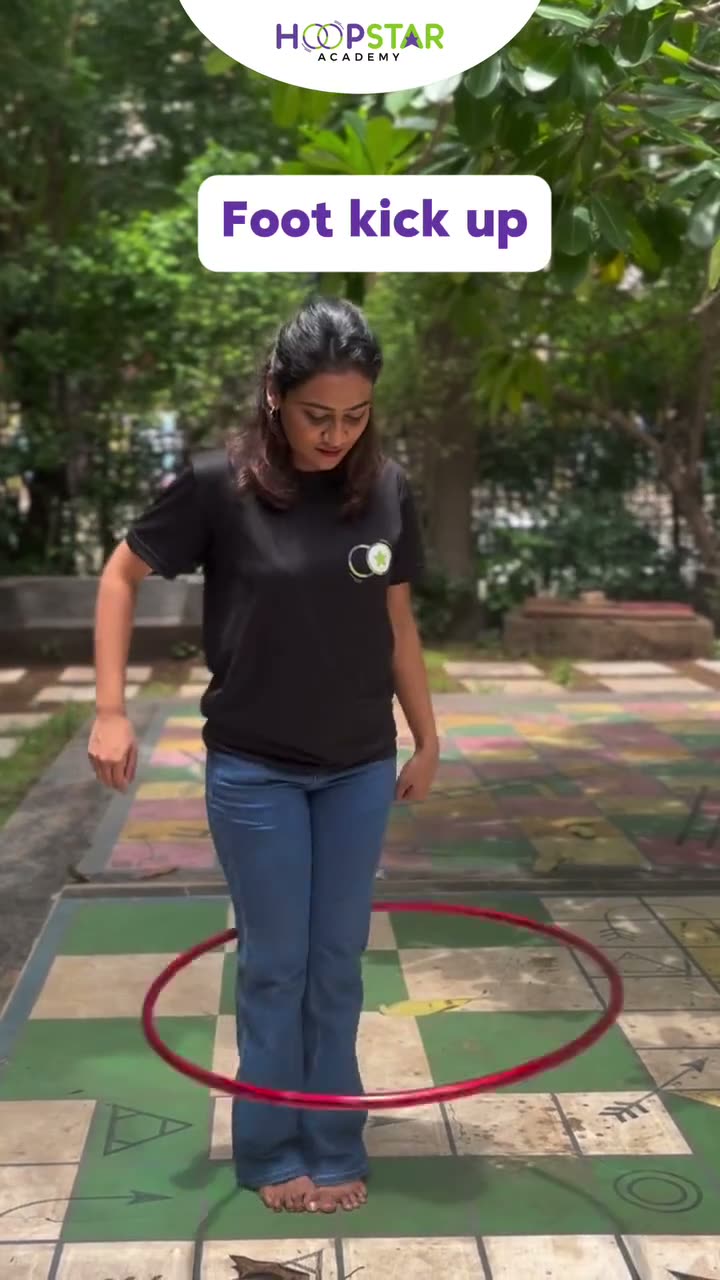 A child demonstrating Foot Kick Up — a Level 6 hula hoop skill