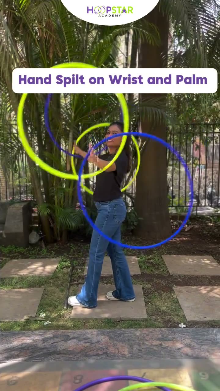 A child demonstrating Hand Split (Finger or Wrist) — a Level 7 hula hoop skill