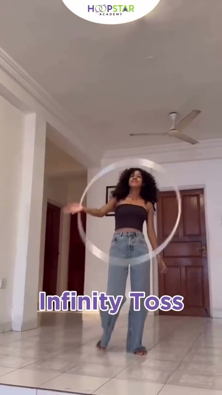 A child demonstrating Infinity Toss — a Level 4 hula hoop skill