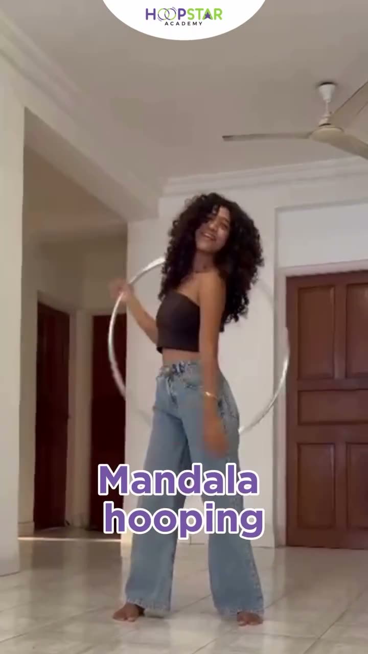 A child demonstrating Mandala Hooping — a Level 4 hula hoop skill