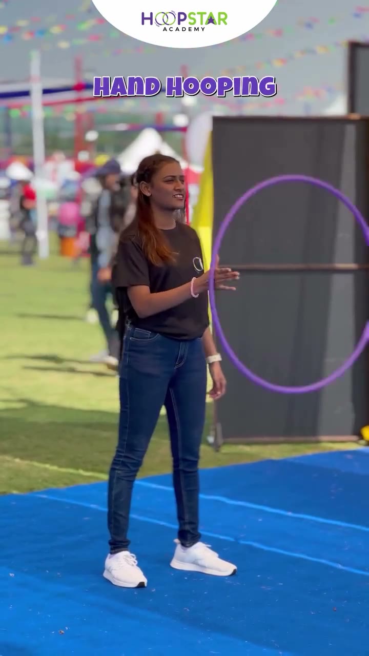 A child demonstrating Neck Hooping — a Level 1 hula hoop skill