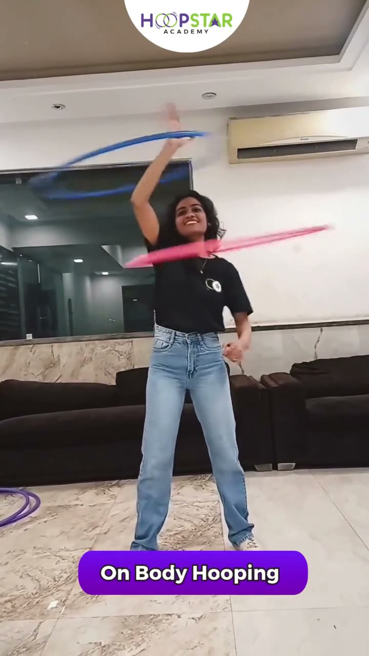 A child demonstrating On-Body Hooping w/ 2 Hoops — a Level 3 hula hoop skill