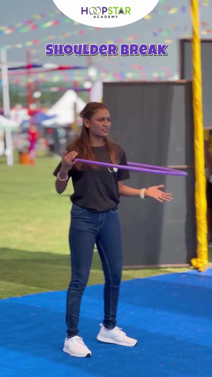A child demonstrating One Hand Isolations — a Level 1 hula hoop skill