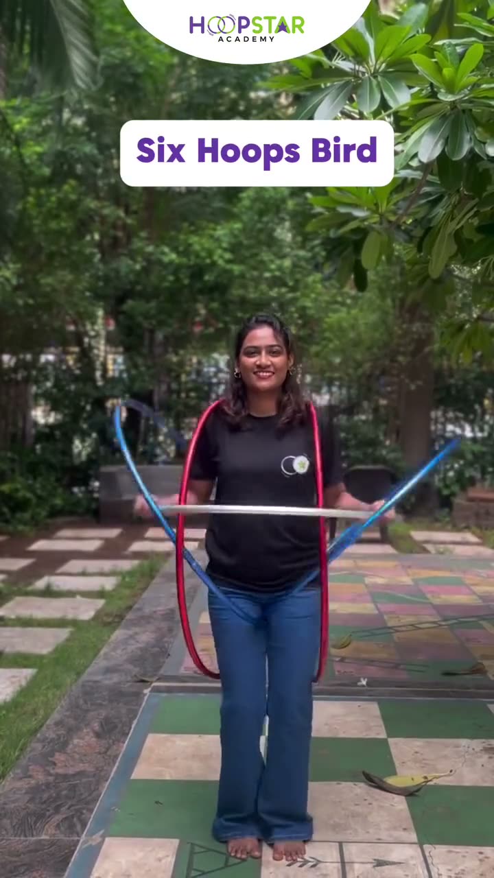 A child demonstrating Six Hoops Bird — a Level 6 hula hoop skill
