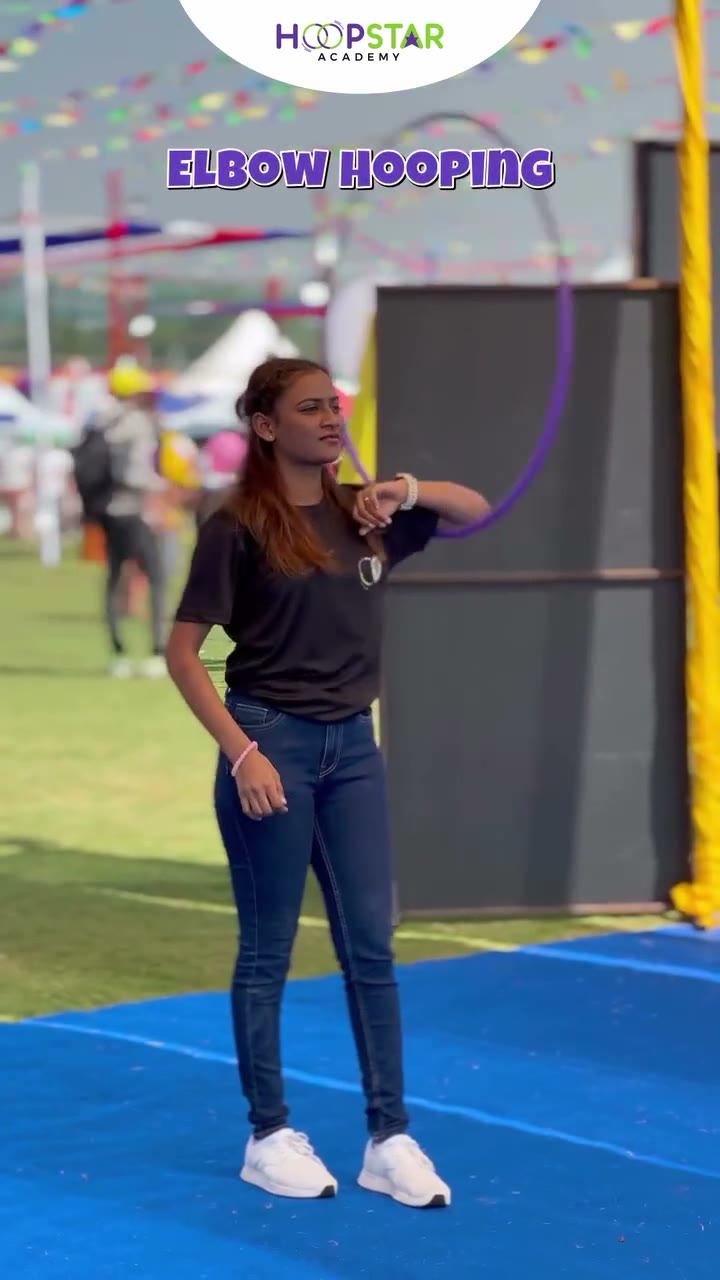 A child demonstrating Smear — a Level 1 hula hoop skill