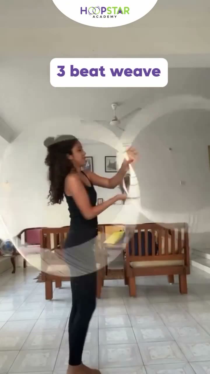 A child demonstrating Three Beat Weave — a Level 5 hula hoop skill