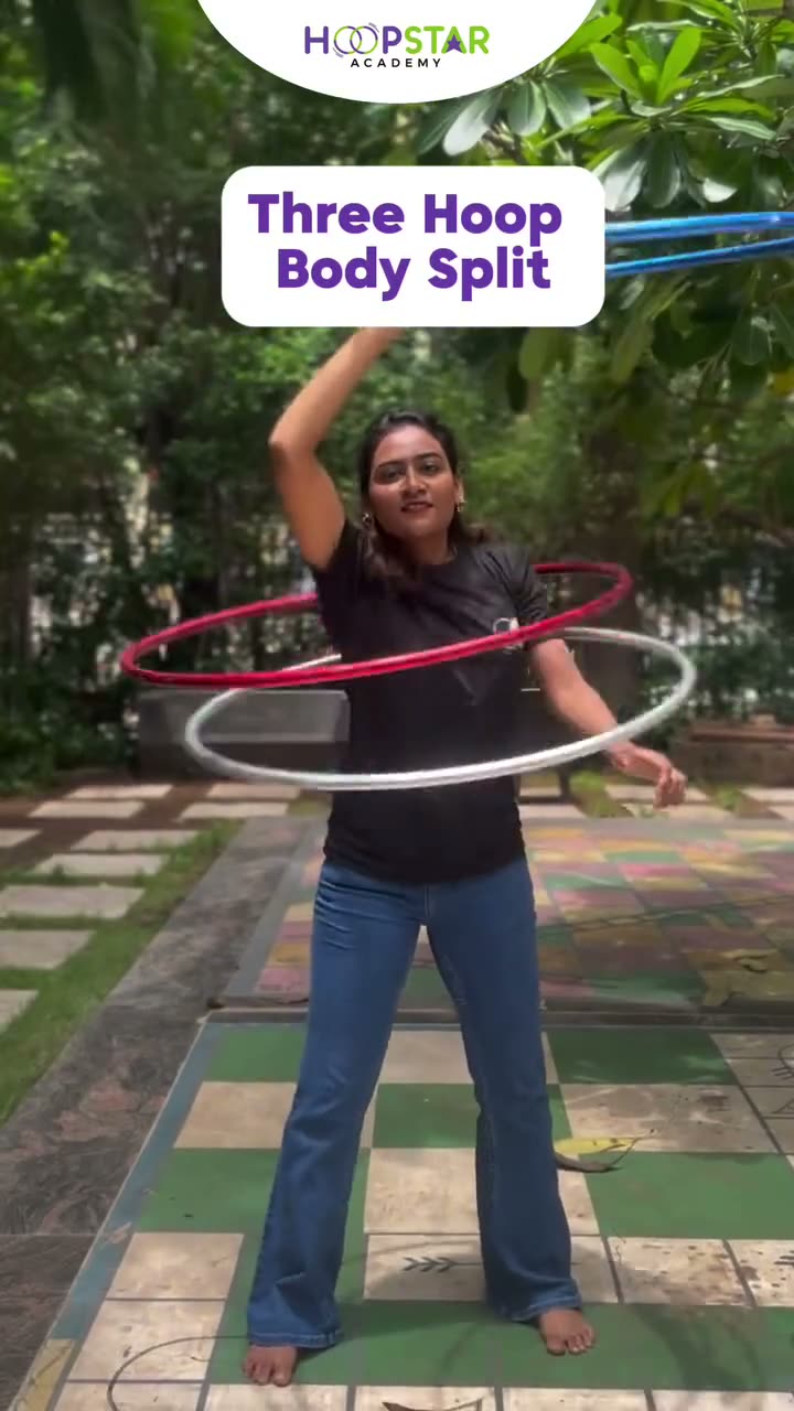 A child demonstrating Three Hoop Body Split — a Level 6 hula hoop skill