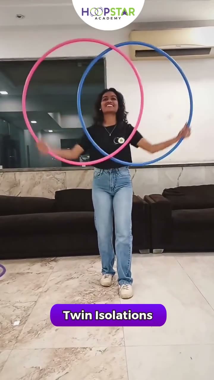 A child demonstrating Twin Isolation — a Level 3 hula hoop skill
