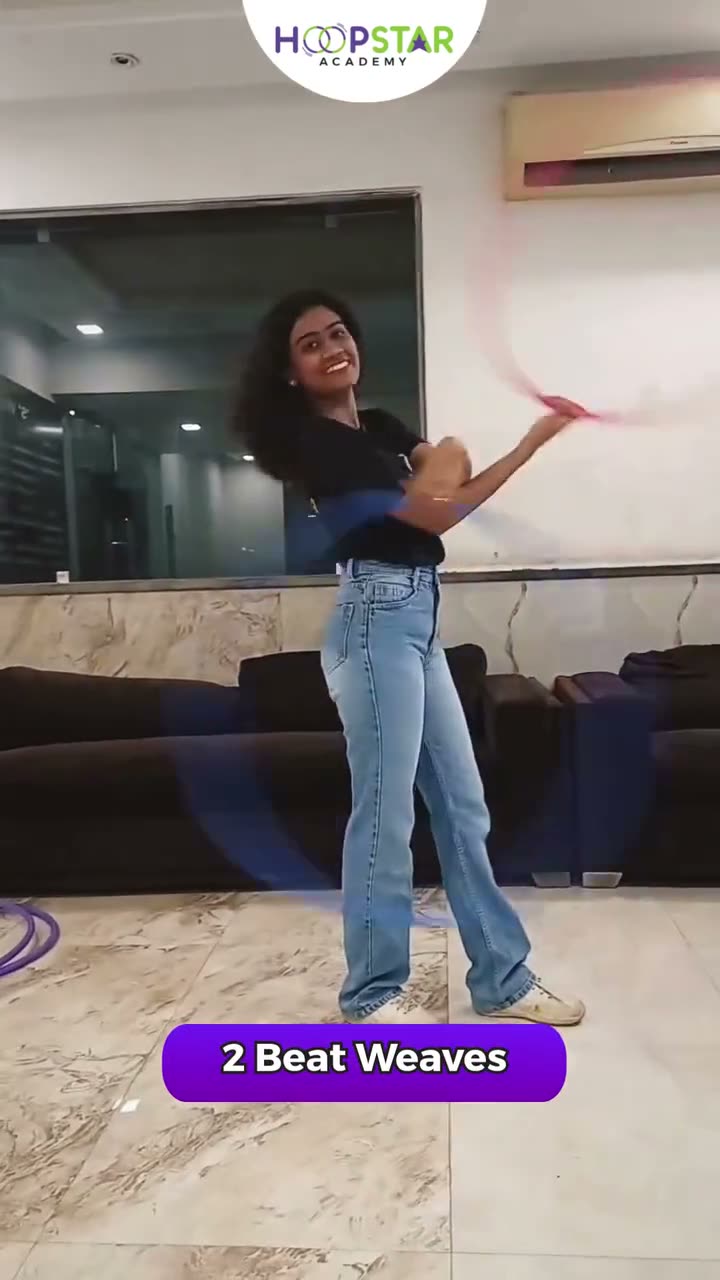 A child demonstrating 2 Beat Weave — a Level 3 hula hoop skill