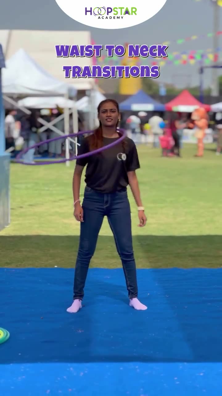 A child demonstrating Waist to Neck — a Level 2 hula hoop skill