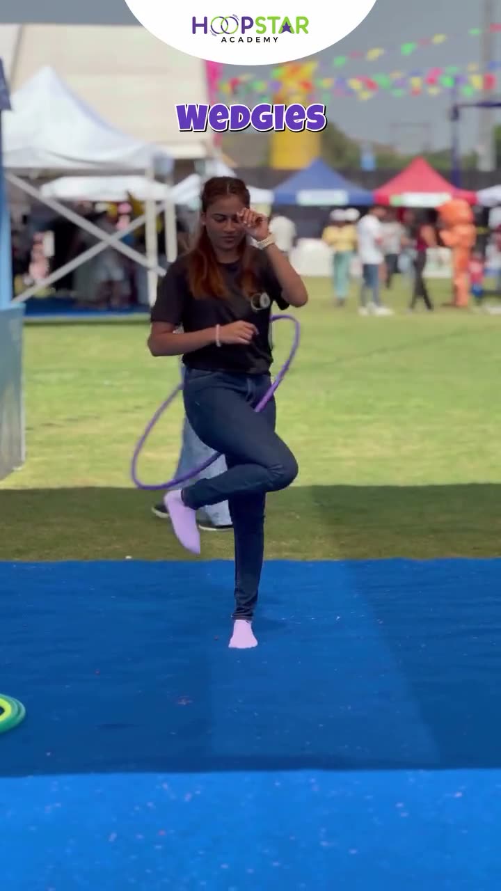 A child demonstrating Wedgies — a Level 4 hula hoop skill
