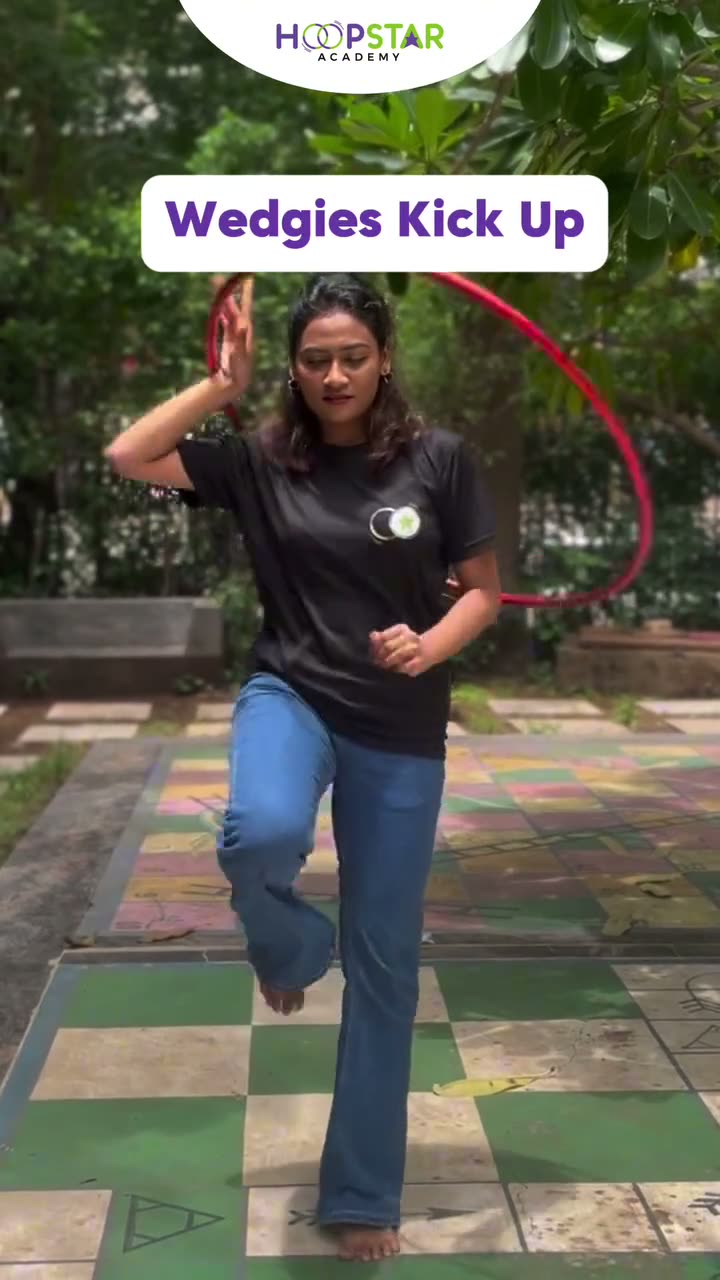 A child demonstrating Wedgies Kick Up — a Level 6 hula hoop skill