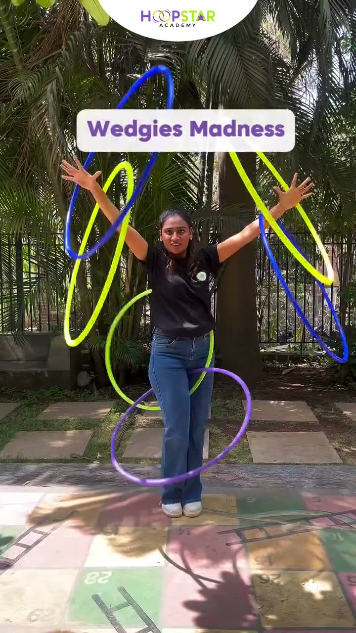 A child demonstrating Wedgies Madness — a Level 7 hula hoop skill